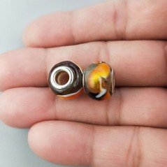 Perlina foro largo nero trasparente con incisioni a fuoco 13.5x8.5mm1pz