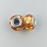 Perlina foro largo dorato con macchie bionde 13.5x8.5mm 1pz