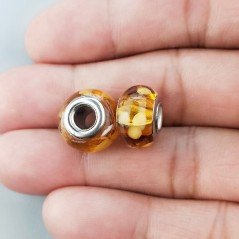 Perlina foro largo dorato con macchie bionde 13.5x8.5mm 1pz