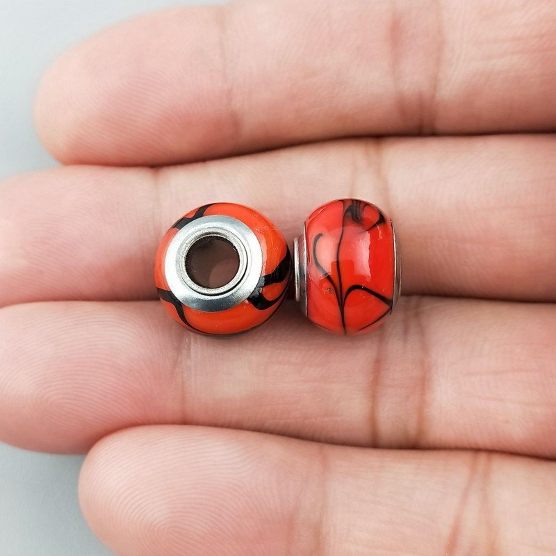 Perlina foro largo arte foglia nera su pietra rossa 13.5x8.5 1pz Perlina foro largo arte foglia nera su pietra rossa 13.5x8.5 1pz