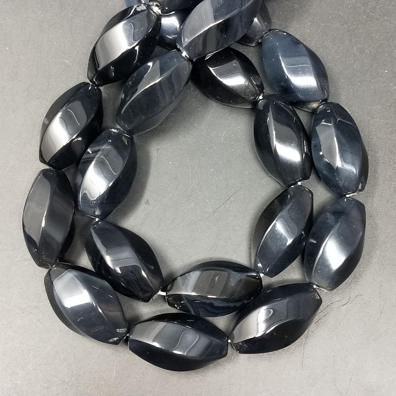 Onice Nera Naturale in Perline Forma Ovale Twist Liscio Foro Passante 14X24mm