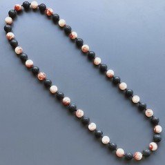 Collana pietra lavica sferica con resina ambra rosso sferico annodato
