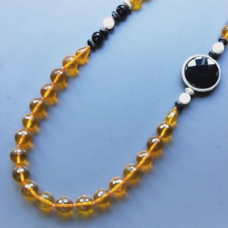 Collana cristallo ambra sferico sfac 12 mm occe sfacc 10x14 mme con pietre dure miste annodato