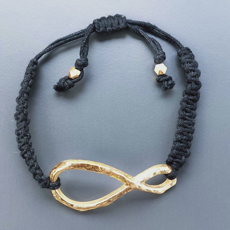 Bracciale Intrecciato con Centrale in Ottone Dorato a Forma Infinito e Chiusura Sali e Scendi