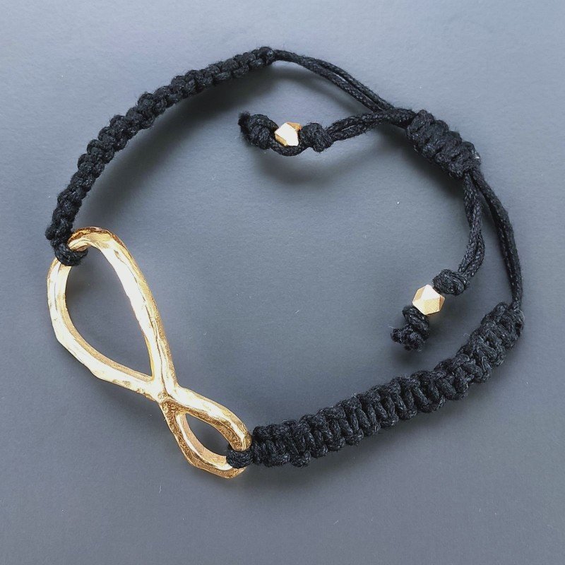 Bracciale Intrecciato con Centrale in Ottone Dorato a Forma Infinito e Chiusura Sali e Scendi