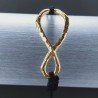 Bracciale Intrecciato con Centrale in Ottone Dorato a Forma Infinito e Chiusura Sali e Scendi