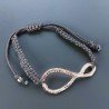 Bracciale Intrecciato con Centrale in Ottone Rosato a Forma Infinito e Chiusura Sali e Scendi