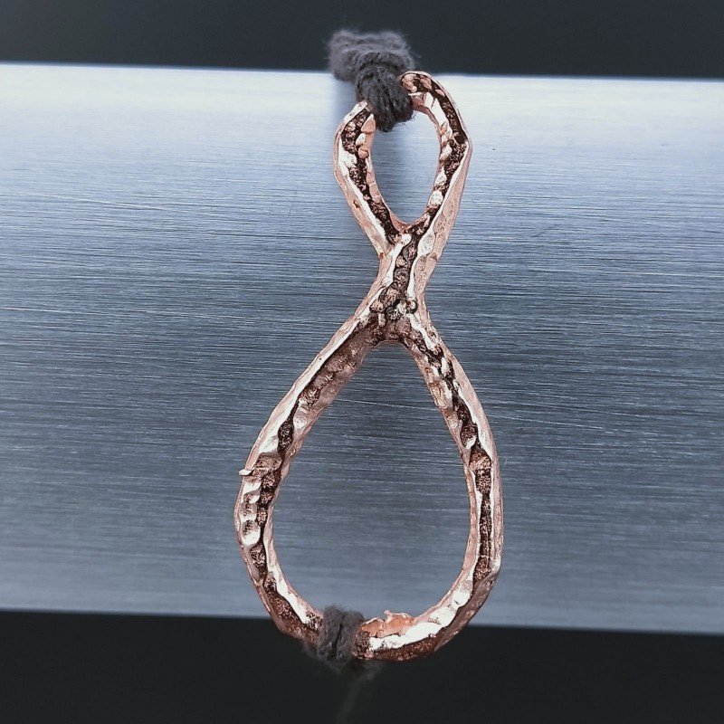 Bracciale Intrecciato con Centrale in Ottone Rosato a Forma Infinito e Chiusura Sali e Scendi