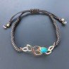 Bracciale Intrecciato con Centrale di Pasta di Turchese in Ottone Dorato e Chiusura Sali e Scendi