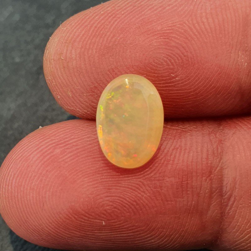 Opale Etiope 'Welo' Naturale Forma Ovale Piatto Cabochon Liscio Fatto a Mano 7,6X10,6X4,5mm 1.70 Carati 1pz Opale Etiope 'Welo' Naturale Forma Ovale Piatto Cabochon Liscio Fatto a Mano 7,6X10,6X4,5mm 1.70 Carati 1pz