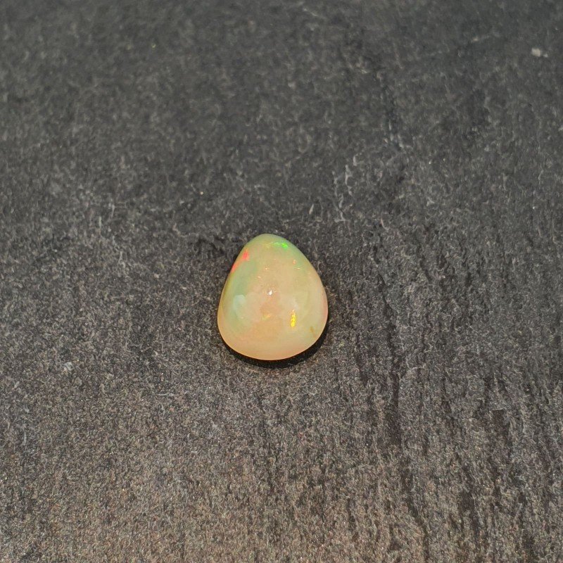 Opale Etiope 'Welo' Naturale Forma Goccia Piatto Cabochon Liscio Fatto a Mano 7x9x4mm 1,20 Carati 1pz