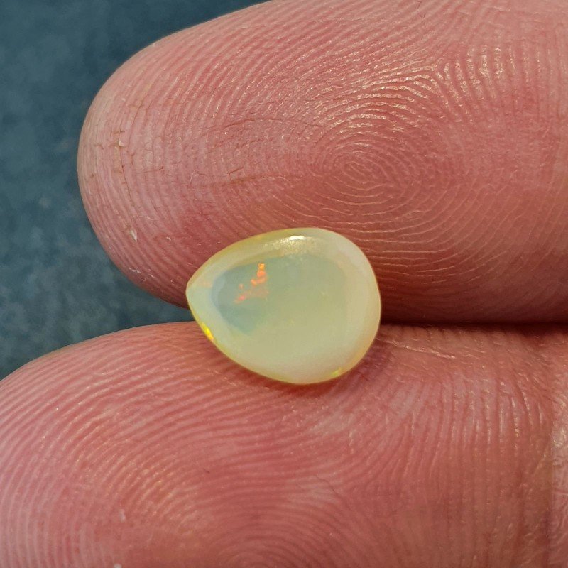 Opale Etiope 'Welo' Naturale Forma Goccia Piatto Cabochon Liscio Fatto a Mano 7x9x4mm 1,20 Carati 1pz