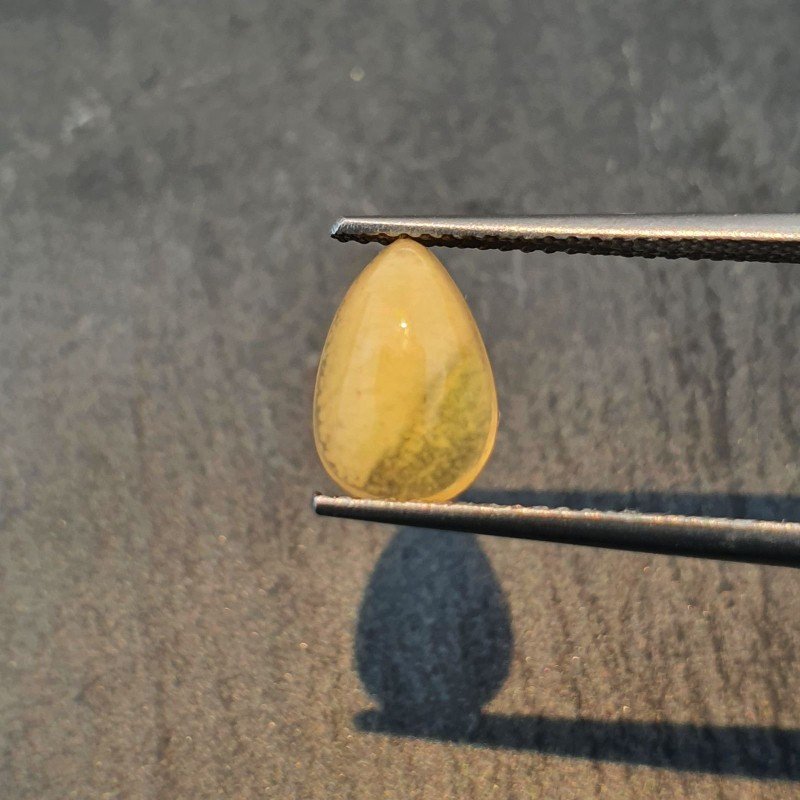 Opale Etiope 'Welo' Naturale Forma Goccia Piatto Cabochon Liscio Fatto a Mano 6x10x4mm 1,05 Carati 1pz