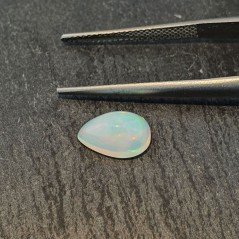 Opale Etiope 'Welo' Naturale Forma Goccia Piatto Cabochon Liscio Fatto a Mano 10x6x5mm 1,55 Carati 1pz