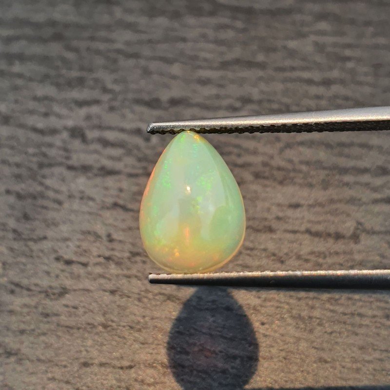 Opale Etiope 'Welo' Naturale Forma Goccia Piatto Cabochon Liscio Fatto a Mano 11x8x5mm 1,90 Carati 1pz