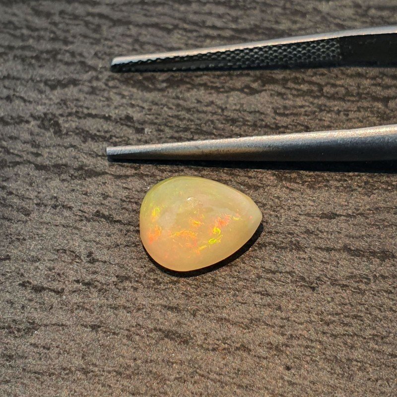 Opale Etiope 'Welo' Naturale Forma Goccia Piatto Cabochon Liscio Fatto a Mano 10x8x6mm 1,95 Carati 1pz