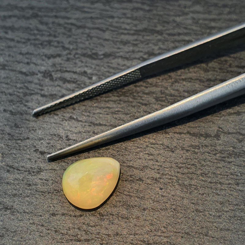 Opale Etiope 'Welo' Naturale Forma Goccia Piatto Cabochon Liscio Fatto a Mano 10x8x6mm 1,95 Carati 1pz