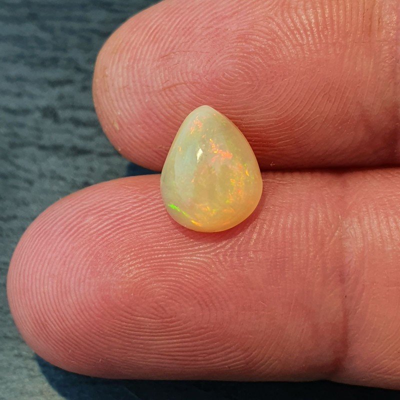 Opale Etiope 'Welo' Naturale Forma Goccia Piatto Cabochon Liscio Fatto a Mano 10x8x6mm 1,95 Carati 1pz