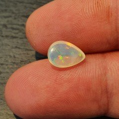 Opale Etiope 'Welo' Naturale Forma Goccia Piatto Cabochon Liscio Fatto a Mano 10x7x4mm 1,20 Carati 1pz