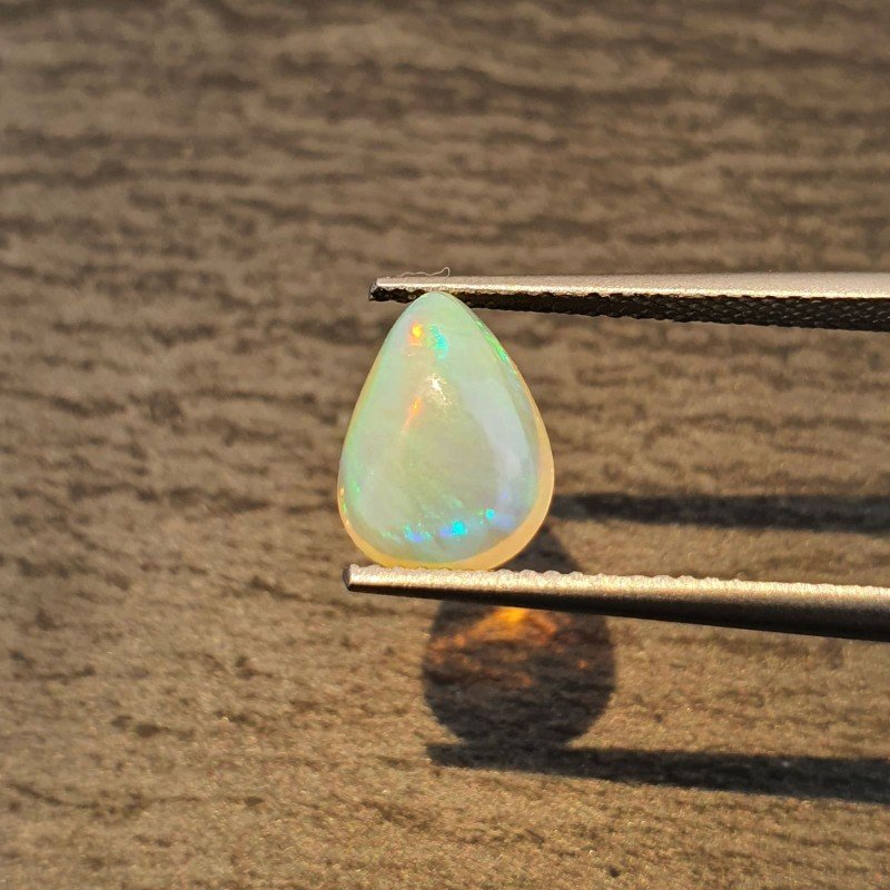 Opale Etiope 'Welo' Naturale Forma Goccia Piatto Cabochon Liscio Fatto a Mano 10x8x4mm 1,40 Carati 1pz
