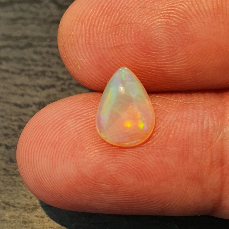 Opale Etiope 'Welo' Naturale Forma Goccia Piatto Cabochon Liscio Fatto a Mano 10x8x4mm 1,40 Carati 1pz