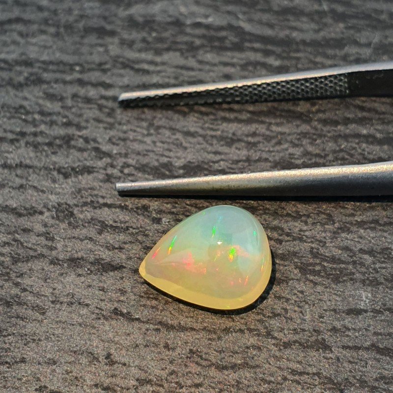 Opale Etiope 'Welo' Naturale Forma Goccia Piatto Cabochon Liscio Fatto a Mano 10x8x6mm 2,10 Carati 1pz