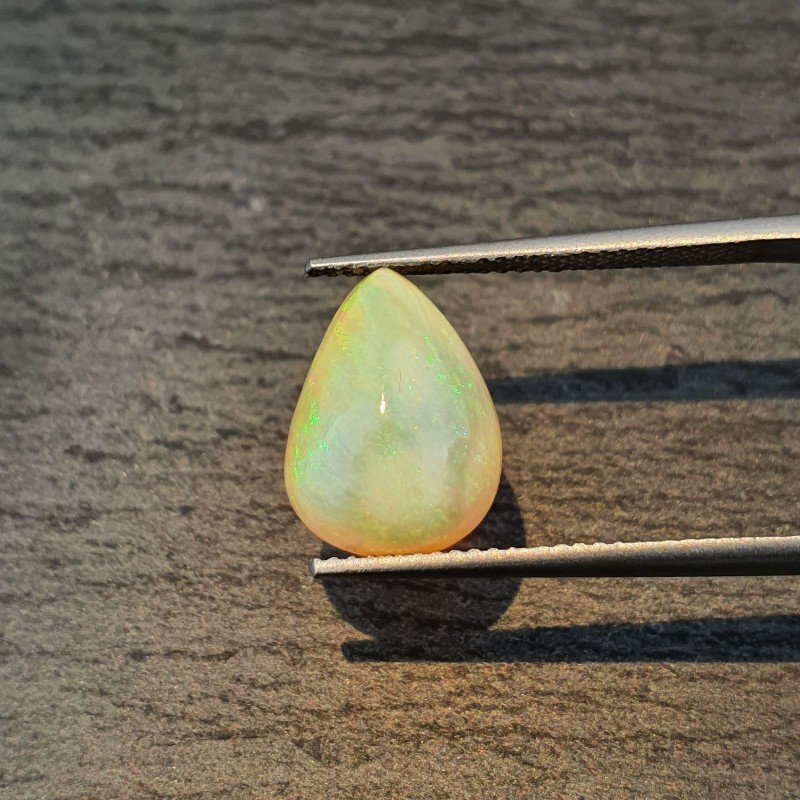 Opale Etiope 'Welo' Naturale Forma Goccia Piatto Cabochon Liscio Fatto a Mano 13X10X6,60mm 3,45 Carati 1pz