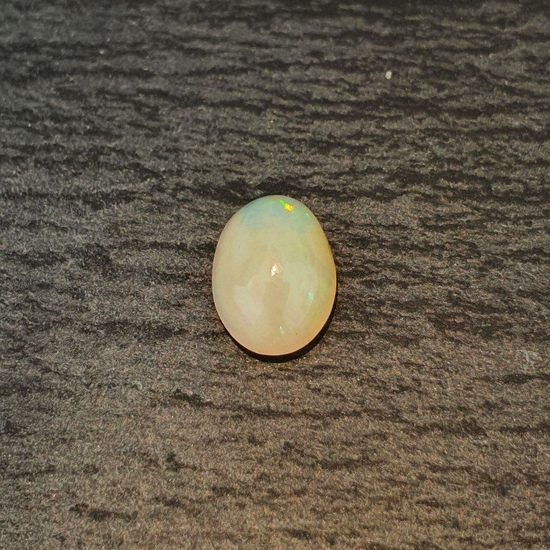 Opale Etiope 'Welo' Naturale Forma Ovale Piatto Cabochon Liscio Fatto a Mano 10X7X4mm 1.35 Carati 1pz