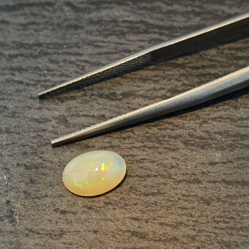 Opale Etiope 'Welo' Naturale Forma Ovale Piatto Cabochon Liscio Fatto a Mano 10X7X4mm 1.35 Carati 1pz