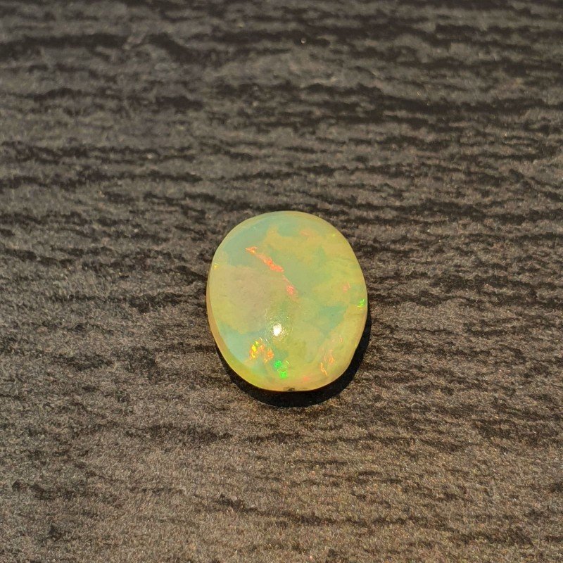 Opale Etiope 'Welo' Naturale Forma Ovale Piatto Cabochon Liscio Fatto a Mano 11,4X9X5mm 2,45 Carati 1pz