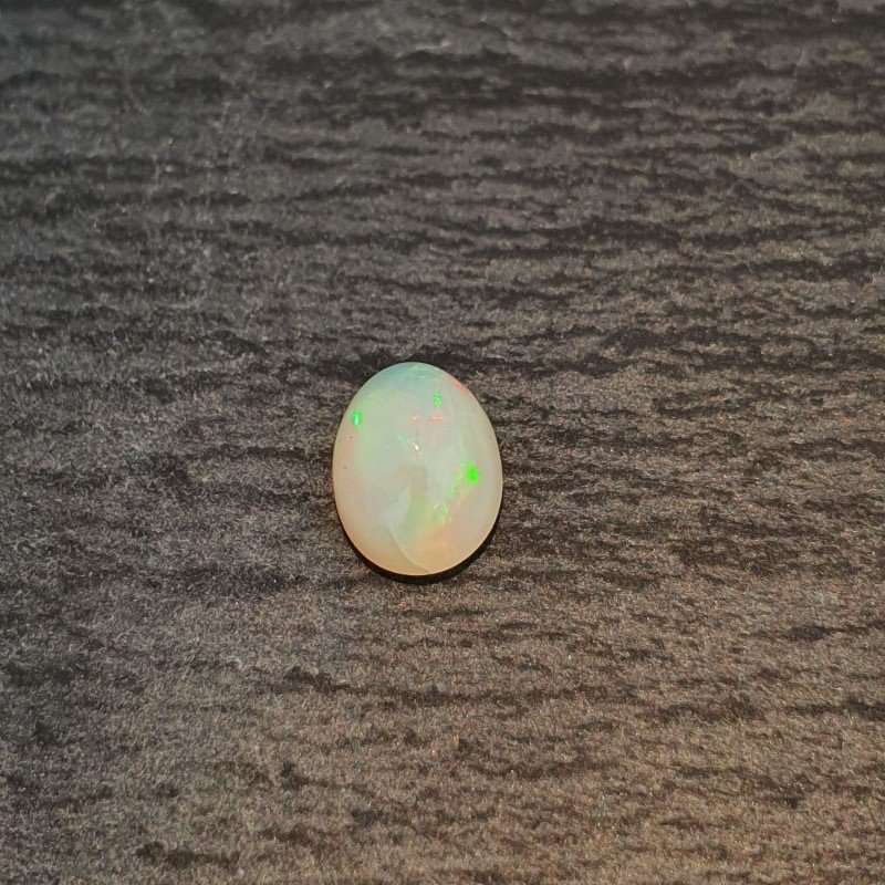Opale Etiope 'Welo' Naturale Forma Ovale Piatto Cabochon Liscio Fatto a Mano 6,5X8,5X4,5mm 1,20 Carati 1pz