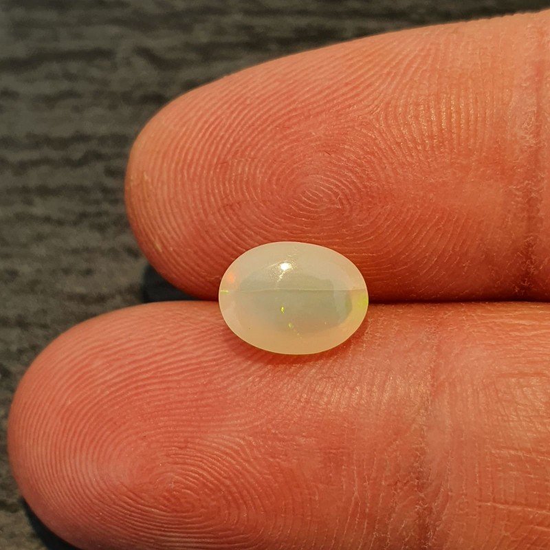 Opale Etiope 'Welo' Naturale Forma Ovale Piatto Cabochon Liscio Fatto a Mano 6,5X8,5X4,5mm 1,20 Carati 1pz