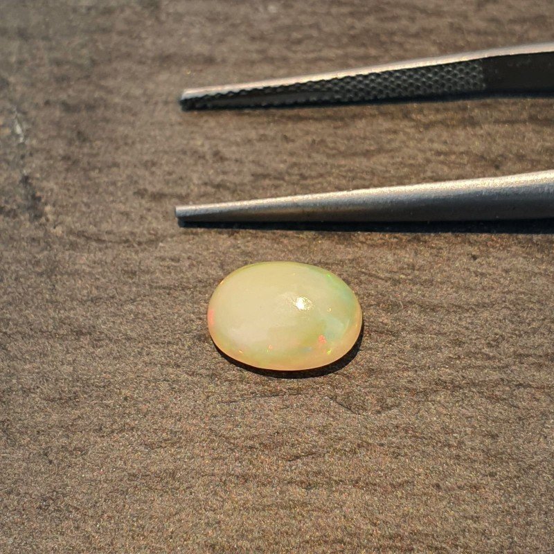 Opale Etiope 'Welo' Naturale Forma Ovale Piatto Cabochon Liscio Fatto a Mano 9X7X3,4mm 1.10 Carati 1pz
