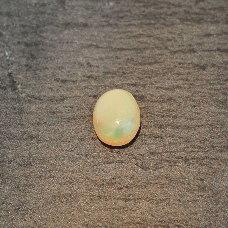 Opale Etiope 'Welo' Naturale Forma Ovale Piatto Cabochon Liscio Fatto a Mano 9X7X3,4mm 1.10 Carati 1pz