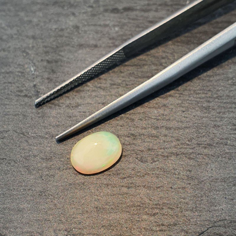 Opale Etiope 'Welo' Naturale Forma Ovale Piatto Cabochon Liscio Fatto a Mano 9X7X3,4mm 1.10 Carati 1pz
