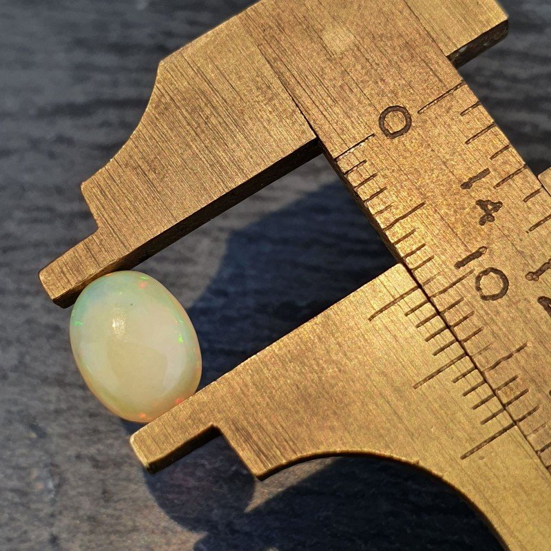 Opale Etiope 'Welo' Naturale Forma Ovale Piatto Cabochon Liscio Fatto a Mano 9X7X3,4mm 1.10 Carati 1pz