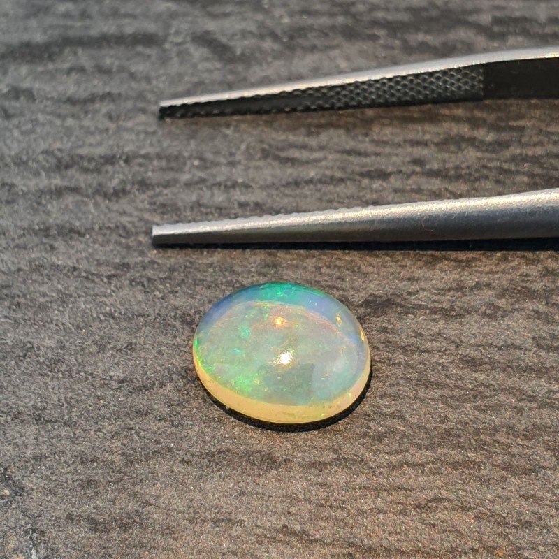Opale Etiope 'Welo' Naturale Forma Ovale Piatto Cabochon Liscio Fatto a Mano 10X8X4mm 1.65 Carati 1pz