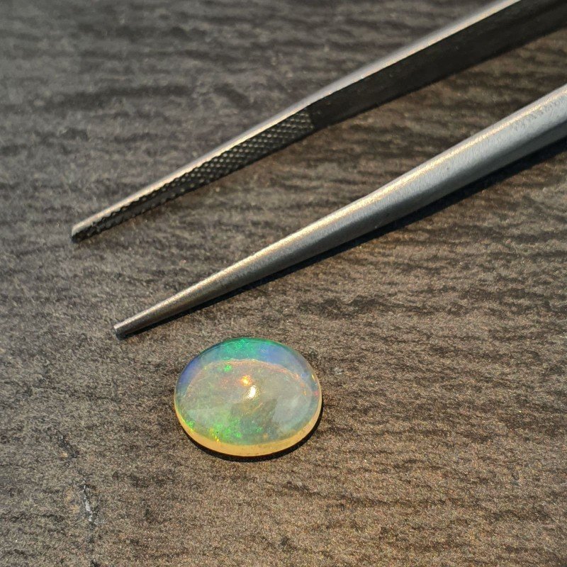 Opale Etiope 'Welo' Naturale Forma Ovale Piatto Cabochon Liscio Fatto a Mano 10X8X4mm 1.65 Carati 1pz