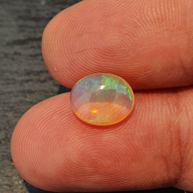 Opale Etiope 'Welo' Naturale Forma Ovale Piatto Cabochon Liscio Fatto a Mano 10X8X4mm 1.65 Carati 1pz