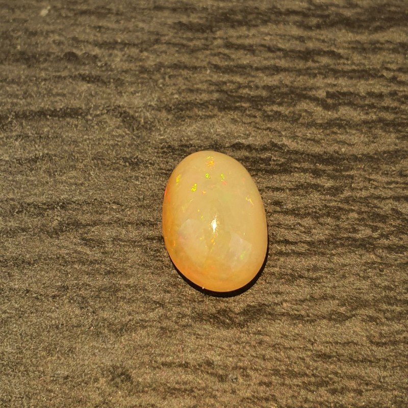 Opale Etiope 'Welo' Naturale Forma Ovale Piatto Cabochon Liscio Fatto a Mano 12X8X5,60mm 2,90 Carati 1pz Opale Etiope 'Welo' Naturale Forma Ovale Piatto Cabochon Liscio Fatto a Mano 12X8X5,60mm 2,90 Carati 1pz