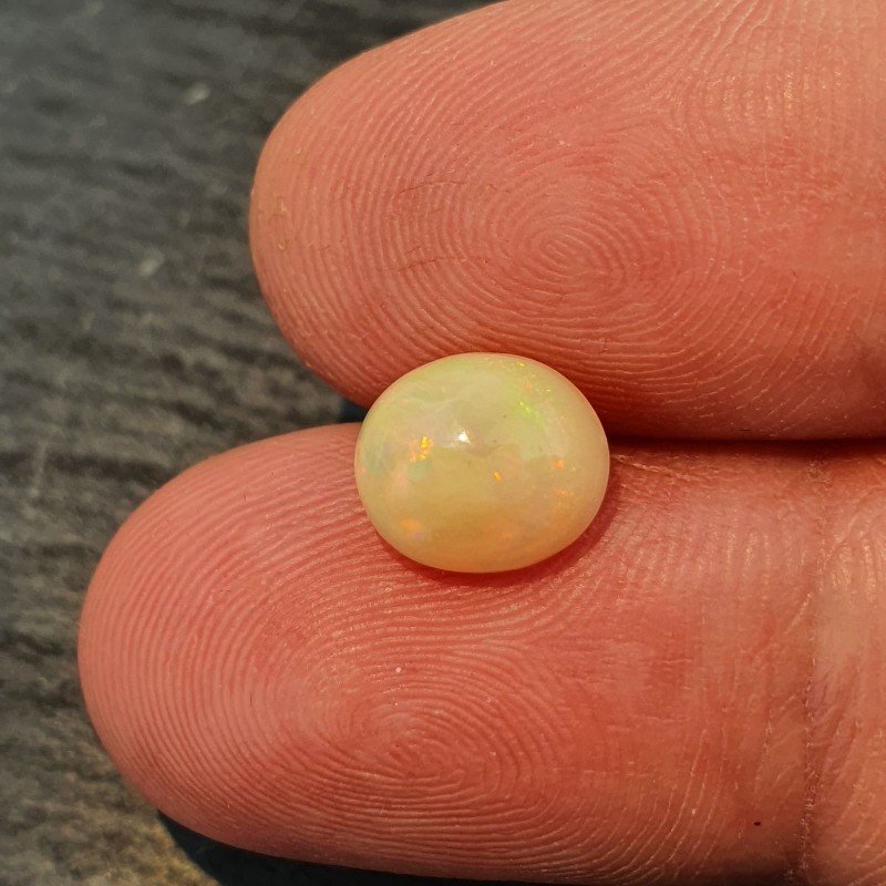 Opale Etiope 'Welo' Naturale Forma Ovale Piatto Cabochon Liscio Fatto a Mano 9X8X5mm 1.65 Carati 1pz