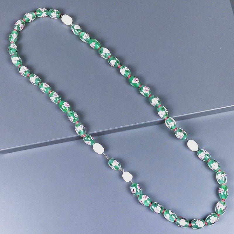 Collana vetro di murano cilindro liscio 12x16 mm con fiore rosa e perle di fiume annodato Collana vetro di murano cilindro liscio 12x16 mm con fiore rosa e perle di fiume annodato